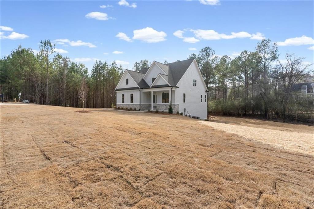 30 Rushden Way Southeast Rome, GA 30161 - Photo 2 of 58 a view of a white house with a yard and a large tree