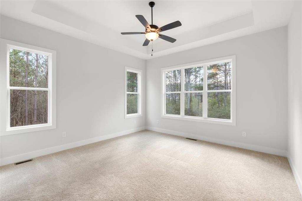 30 Rushden Way Southeast Rome, GA 30161 - Photo 24 of 58 an empty room with a window and a ceiling fan