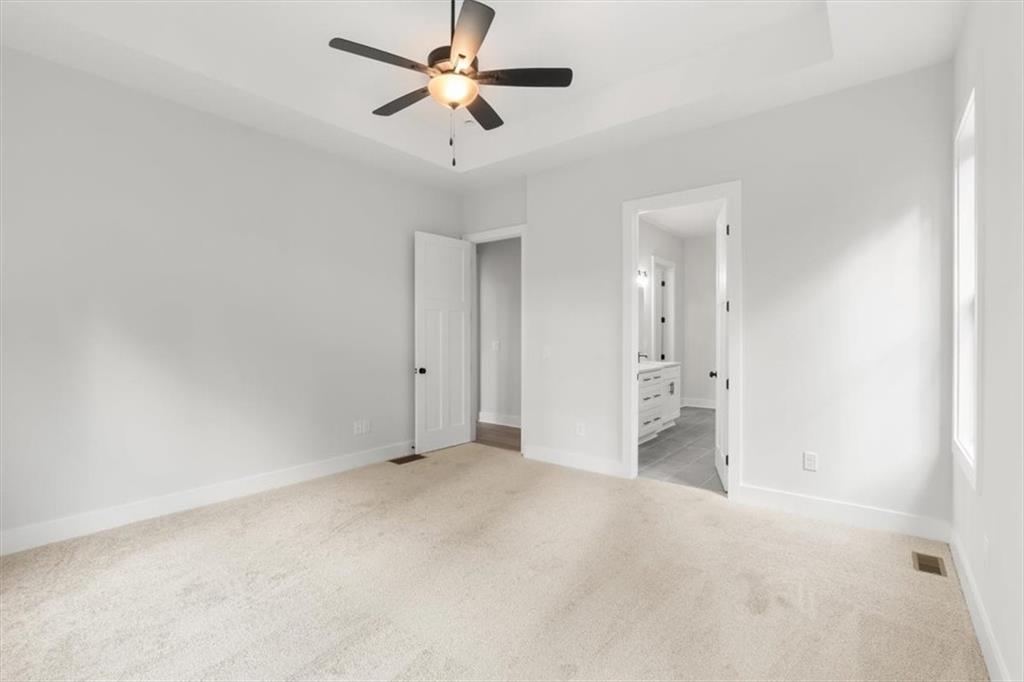 30 Rushden Way Southeast Rome, GA 30161 - Photo 25 of 58 an empty room with a ceiling fan and a fan
