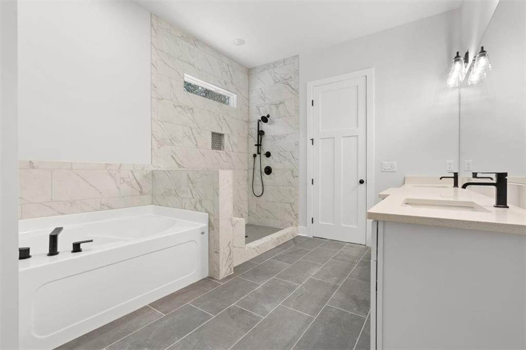 30 Rushden Way Southeast Rome, GA 30161 - Photo 29 of 58 a bathroom with a bathtub and a sink