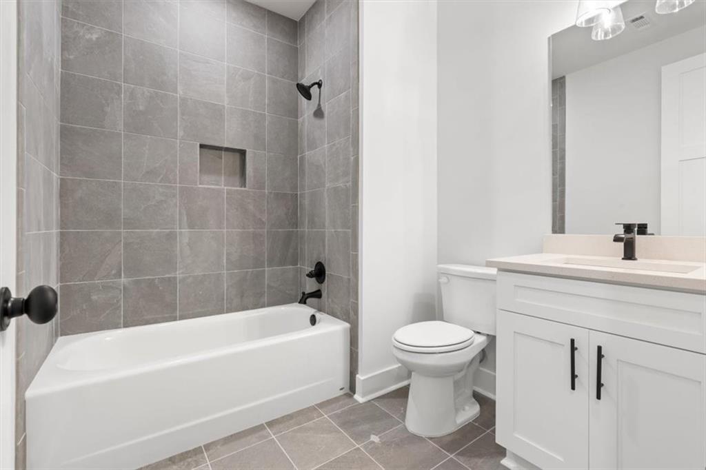 30 Rushden Way Southeast Rome, GA 30161 - Photo 32 of 58 a bathroom with a sink a toilet and a bathtub