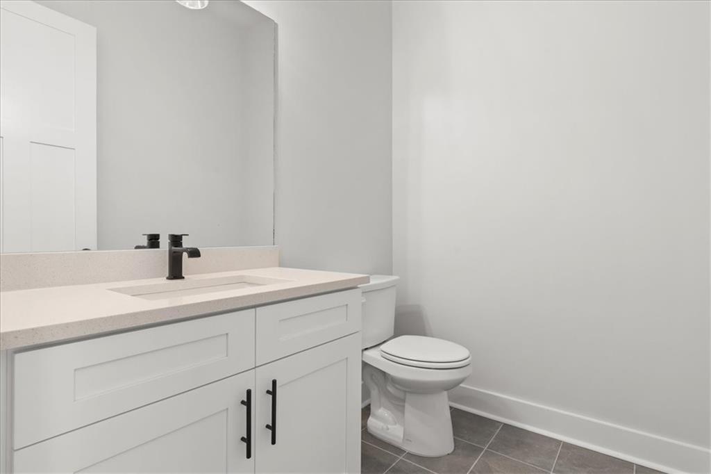 30 Rushden Way Southeast Rome, GA 30161 - Photo 35 of 58 a bathroom with a sink a toilet and a mirror