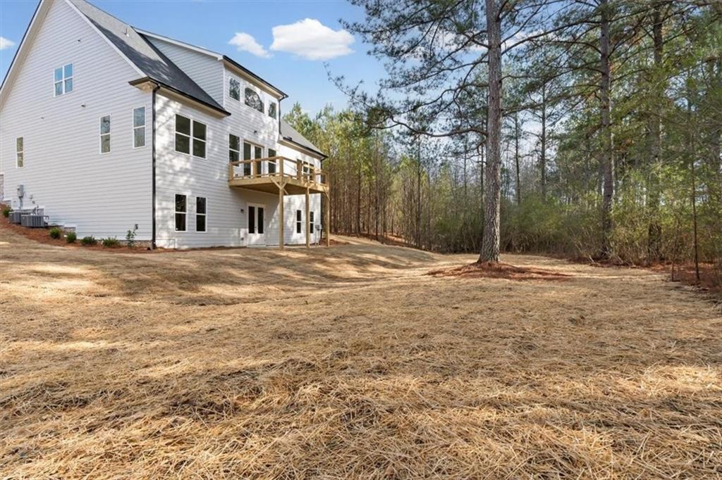 30 Rushden Way Southeast Rome, GA 30161 - Photo 49 of 58 a backyard of a house with large trees