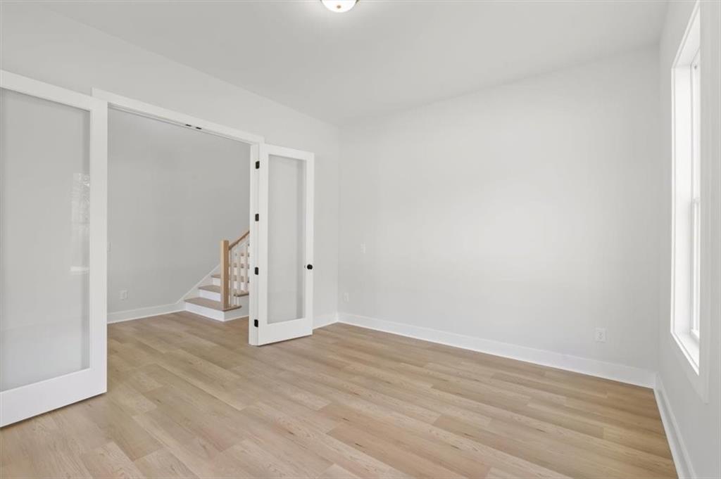 30 Rushden Way Southeast Rome, GA 30161 - Photo 10 of 58 an empty room with wooden floor and white walls