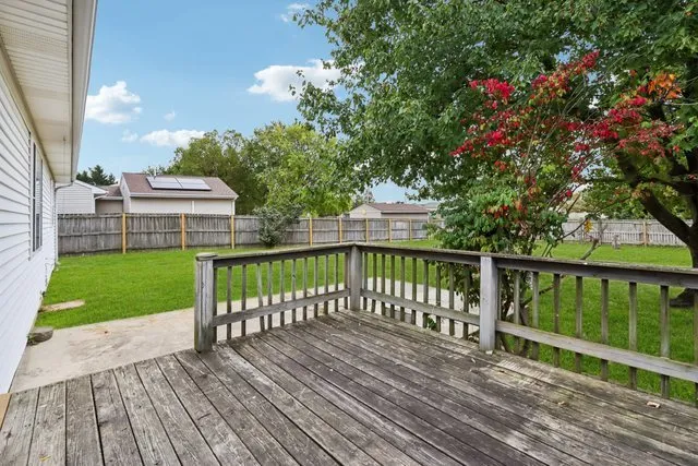 a view of a deck with a yard