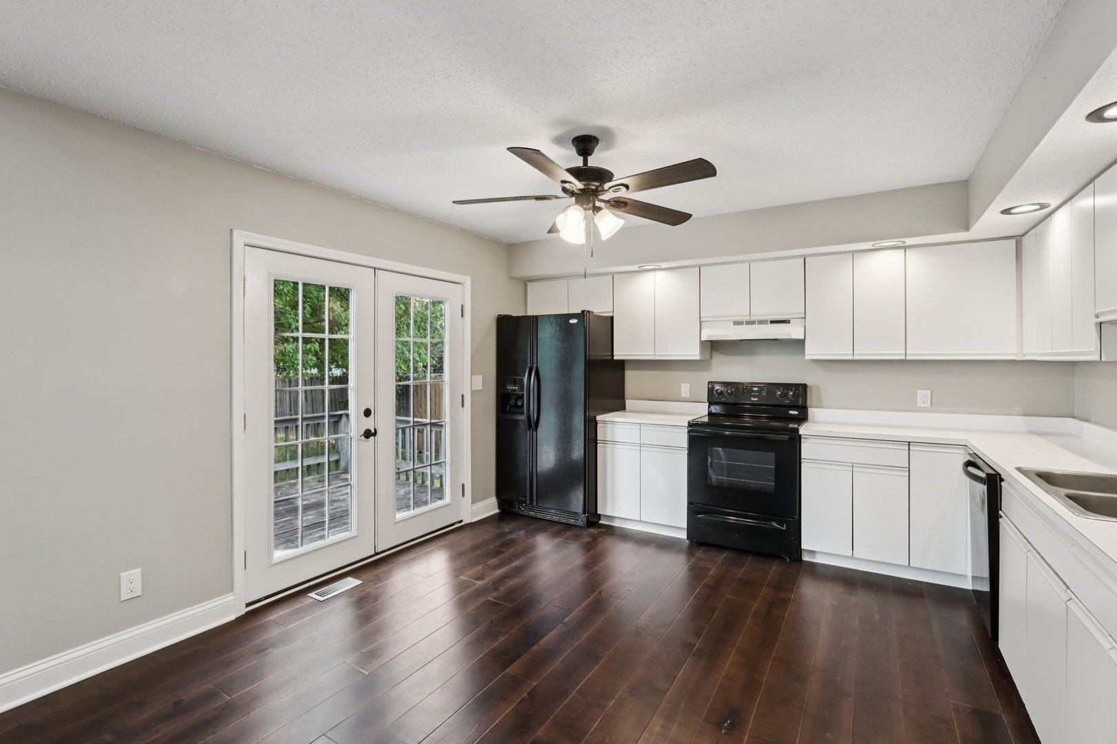 3103 Timberline Drive Champaign, IL 61822 - Photo 5 of 19 a kitchen with stainless steel appliances a stove a refrigerator a sink and a microwave
