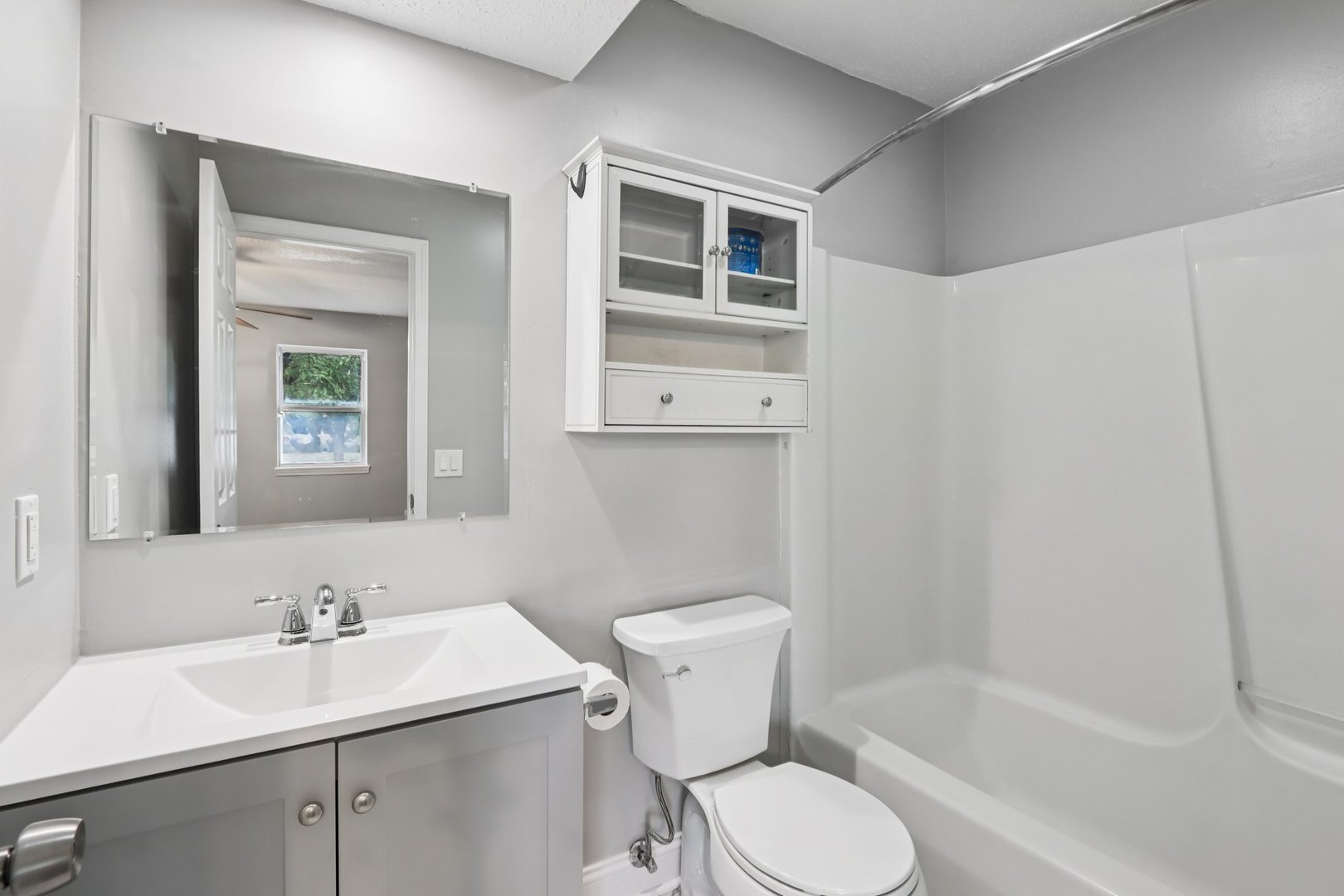 3103 Timberline Drive Champaign, IL 61822 - Photo 10 of 19 a bathroom with a sink toilet a mirror and shower