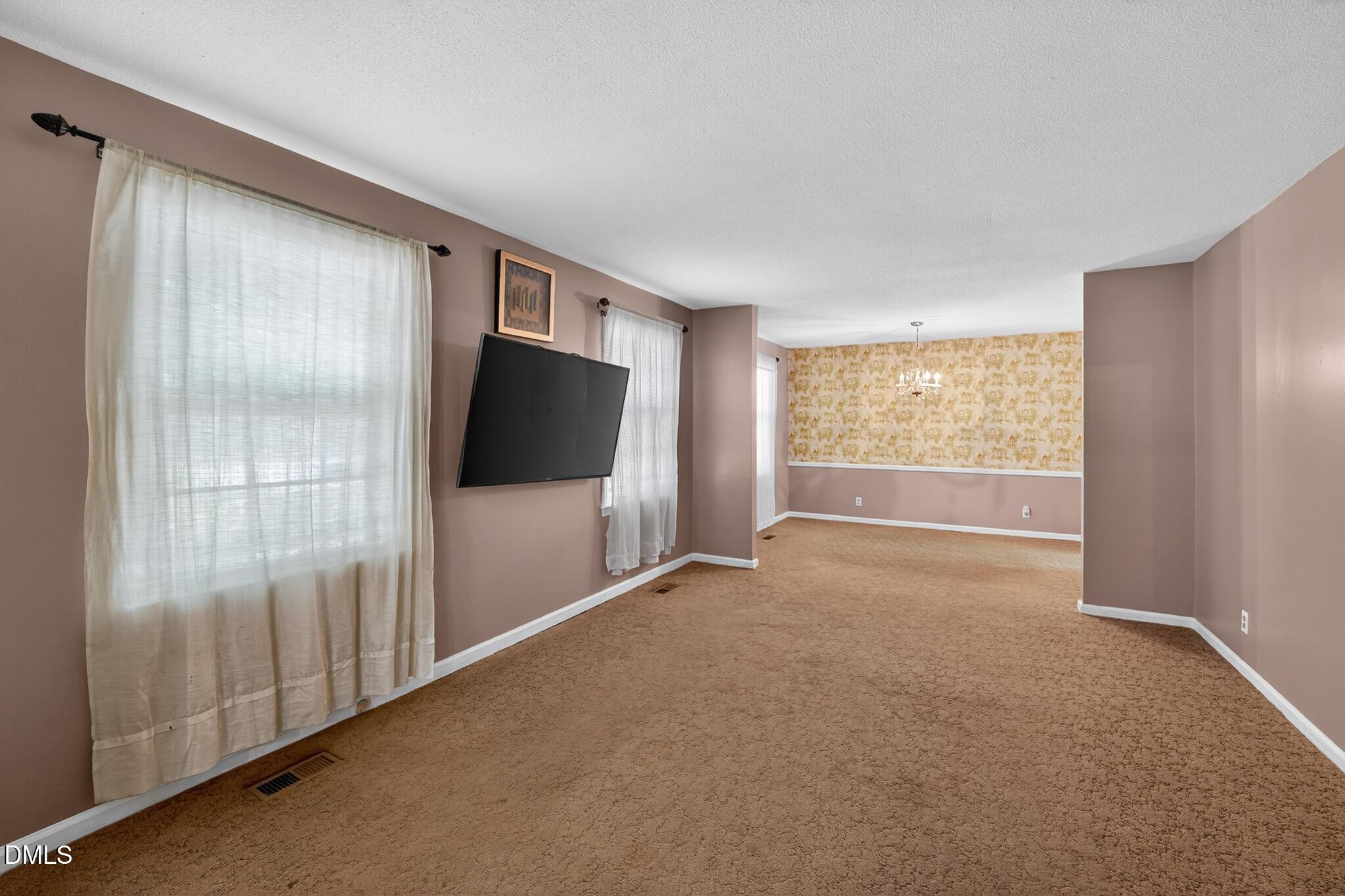 1034 Jerome Road Durham, NC 27713 - Photo 6 of 35 a view of an empty room with a window