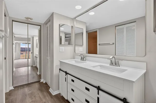 a bathroom with a sink a toilet and mirror