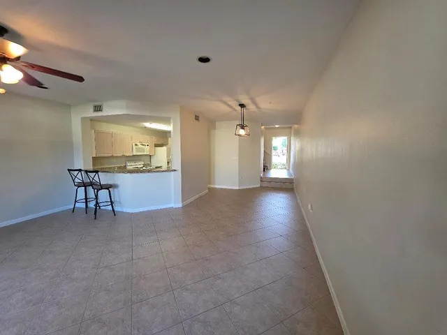 a view of livingroom with hardwood floor and a ceiling fan
