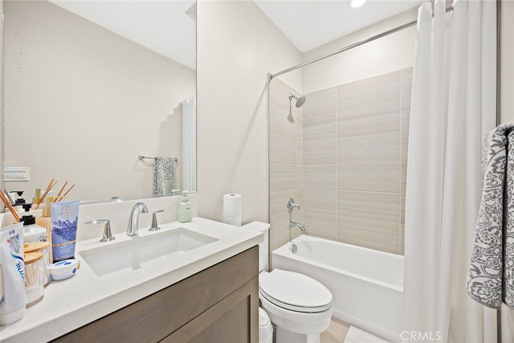 478 Sycamore Montebello, CA 90640 - Photo 21 of 67 a bathroom with a granite countertop sink a toilet and shower
