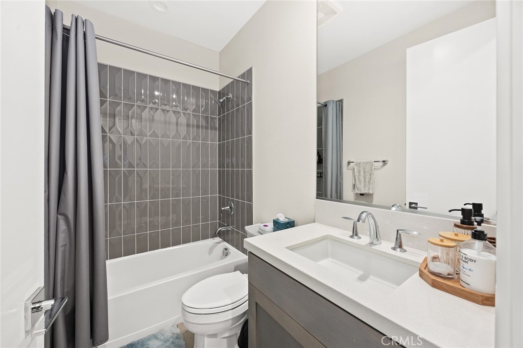 478 Sycamore Montebello, CA 90640 - Photo 23 of 67 a bathroom with a granite countertop sink a toilet and bathtub