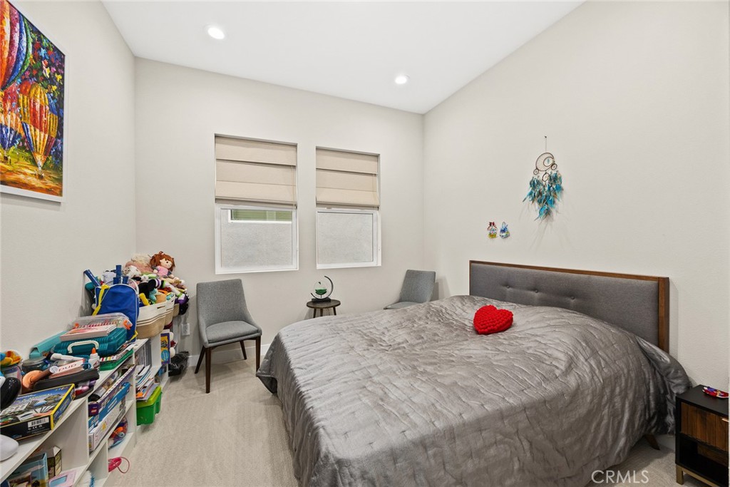 478 Sycamore Montebello, CA 90640 - Photo 24 of 67 a bedroom with a bed and a window