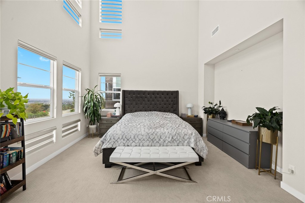 478 Sycamore Montebello, CA 90640 - Photo 27 of 67 a bedroom with a bed and a potted plant