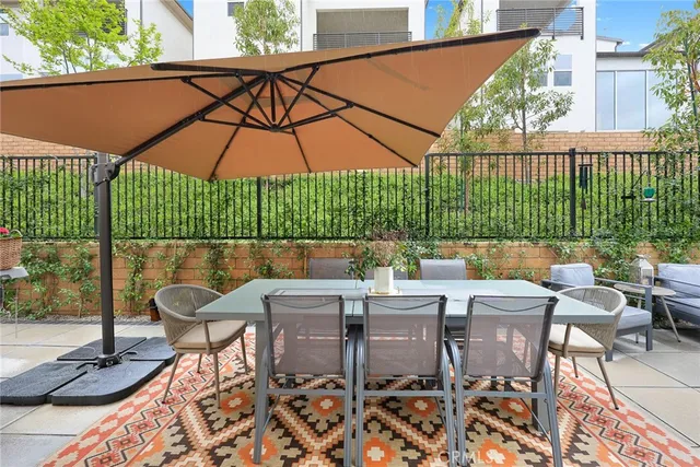 a view of a garden with a building in the background