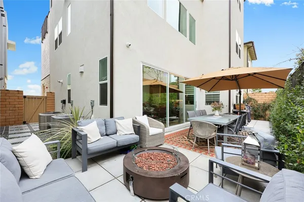 a swimming pool with outdoor seating and yard