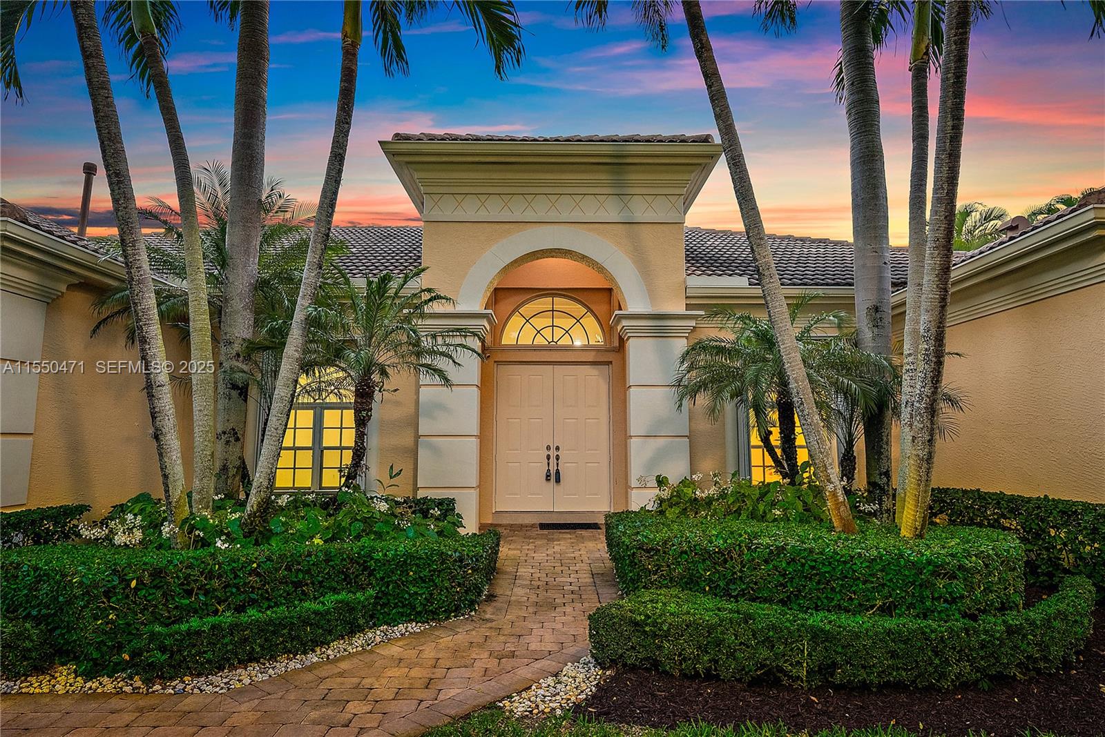 a view of a brick house with a clock on the wall