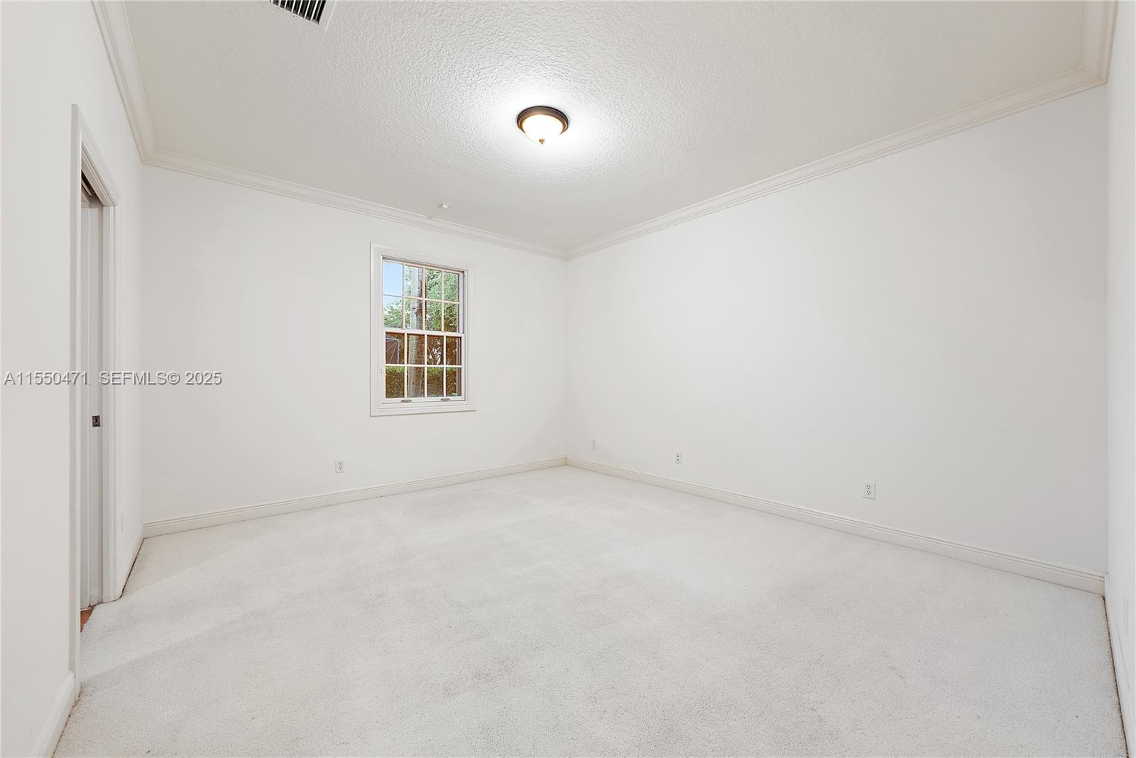 133 Mystic Lane Jupiter, FL 33458 - Photo 17 of 56 an empty room with windows