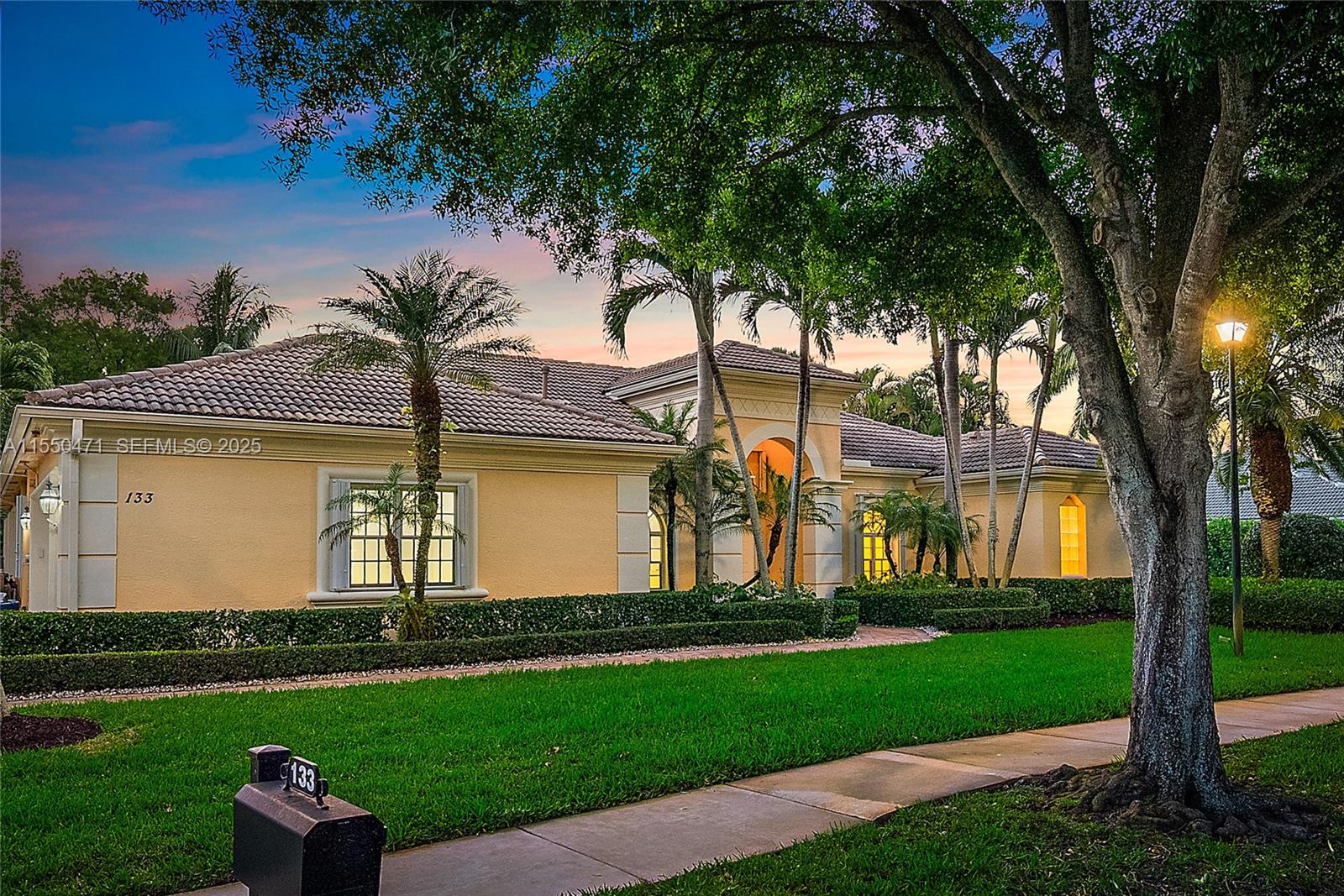 133 Mystic Lane Jupiter, FL 33458 - Photo 5 of 56 front view of a house with a yard