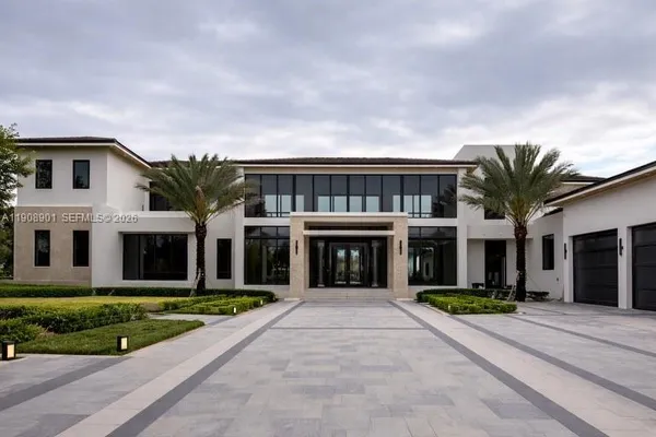 a front view of building with yard