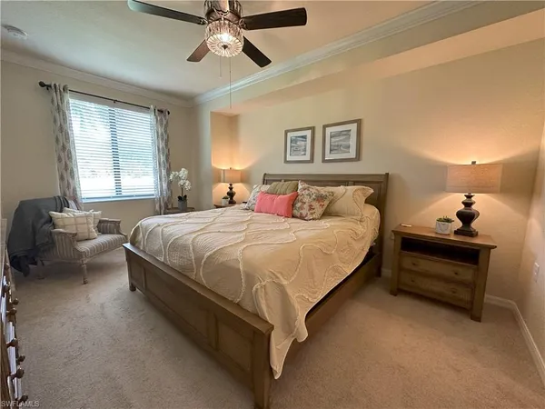 a spacious bedroom with a bed and window