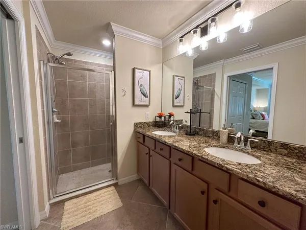 a bathroom with a granite countertop sink mirror and double