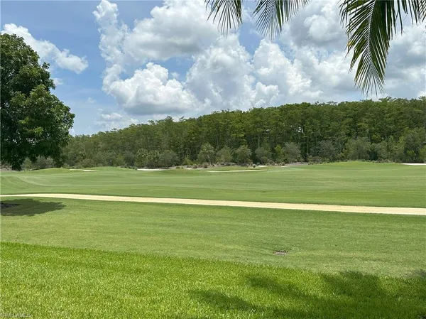 a view of a swimming pool and a yard