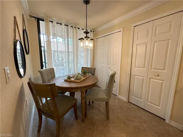 a view of a dining room with furniture window and outside view