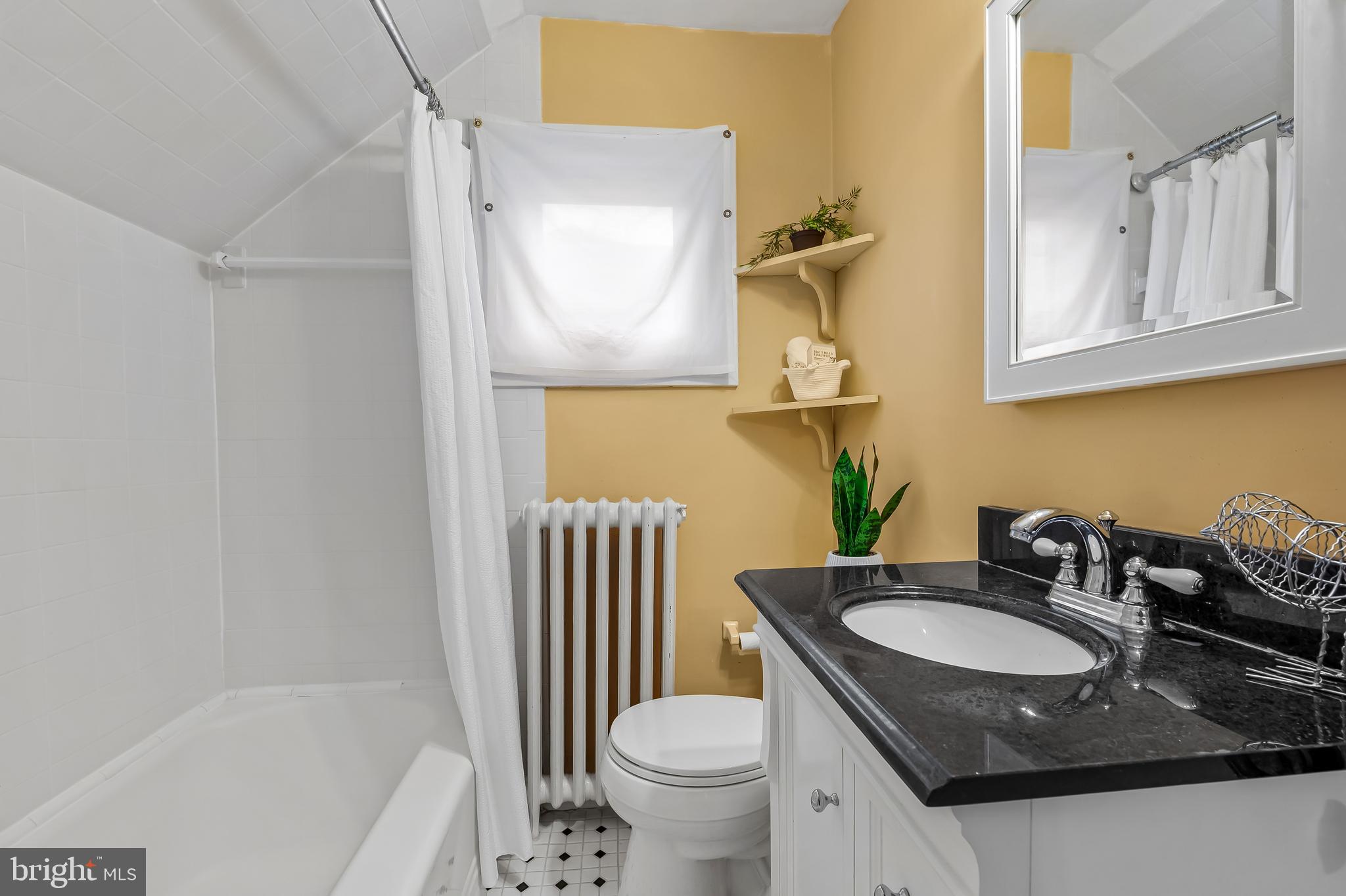 529 Overbrook Road Baltimore, MD 21212 - Photo 37 of 40 a bathroom with a granite countertop sink toilet and a mirror