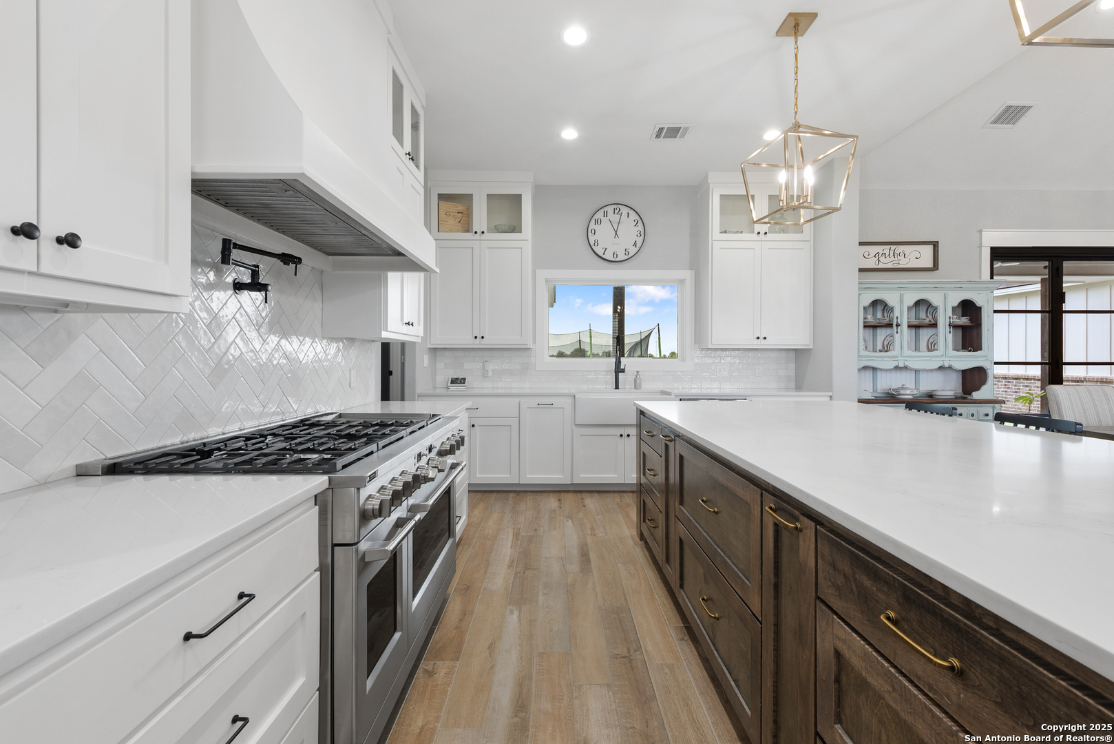 32139 Giboney Road Hempstead, TX 77445 - Photo 12 of 65 a kitchen with stainless steel appliances granite countertop a sink a stove and a wooden floors