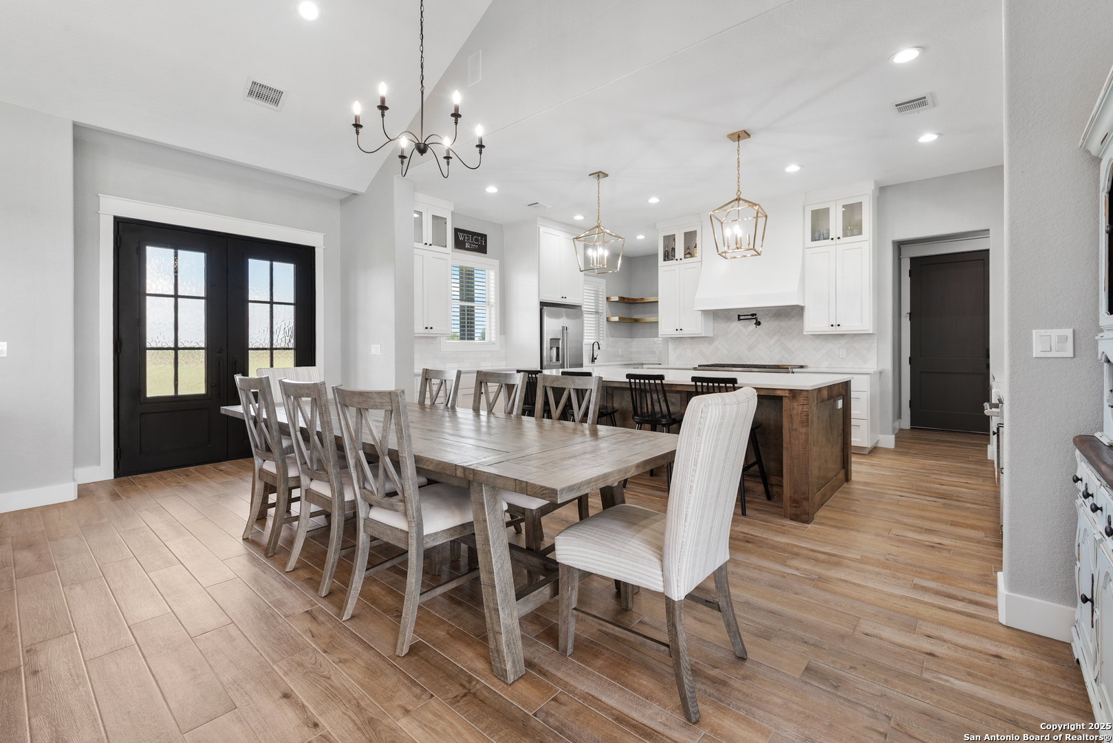 32139 Giboney Road Hempstead, TX 77445 - Photo 14 of 65 a view of a dining room with furniture and wooden floor
