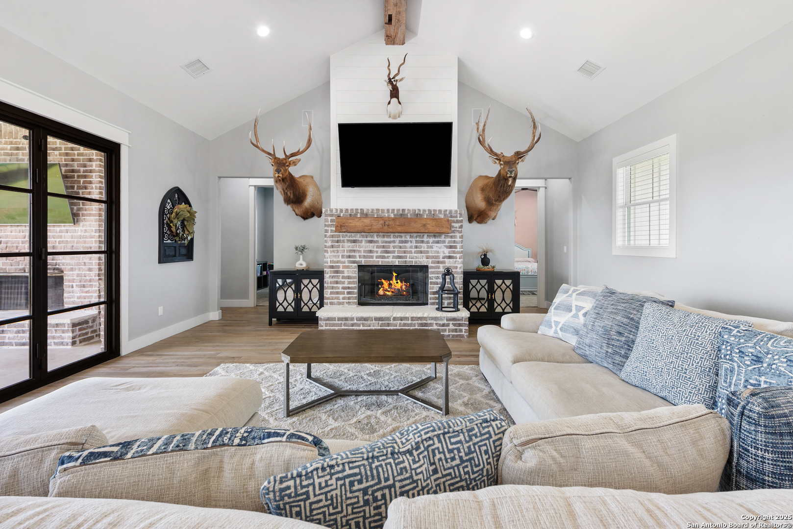 32139 Giboney Road Hempstead, TX 77445 - Photo 17 of 65 a living room with furniture fireplace and flat screen tv