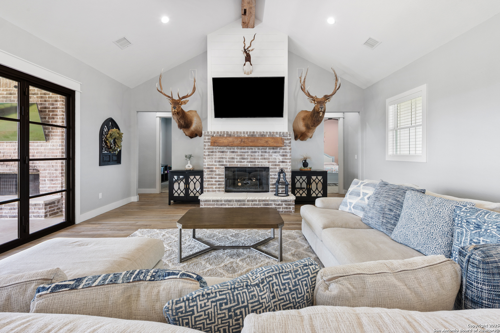 32139 Giboney Road Hempstead, TX 77445 - Photo 18 of 65 a living room with furniture fireplace and flat screen tv