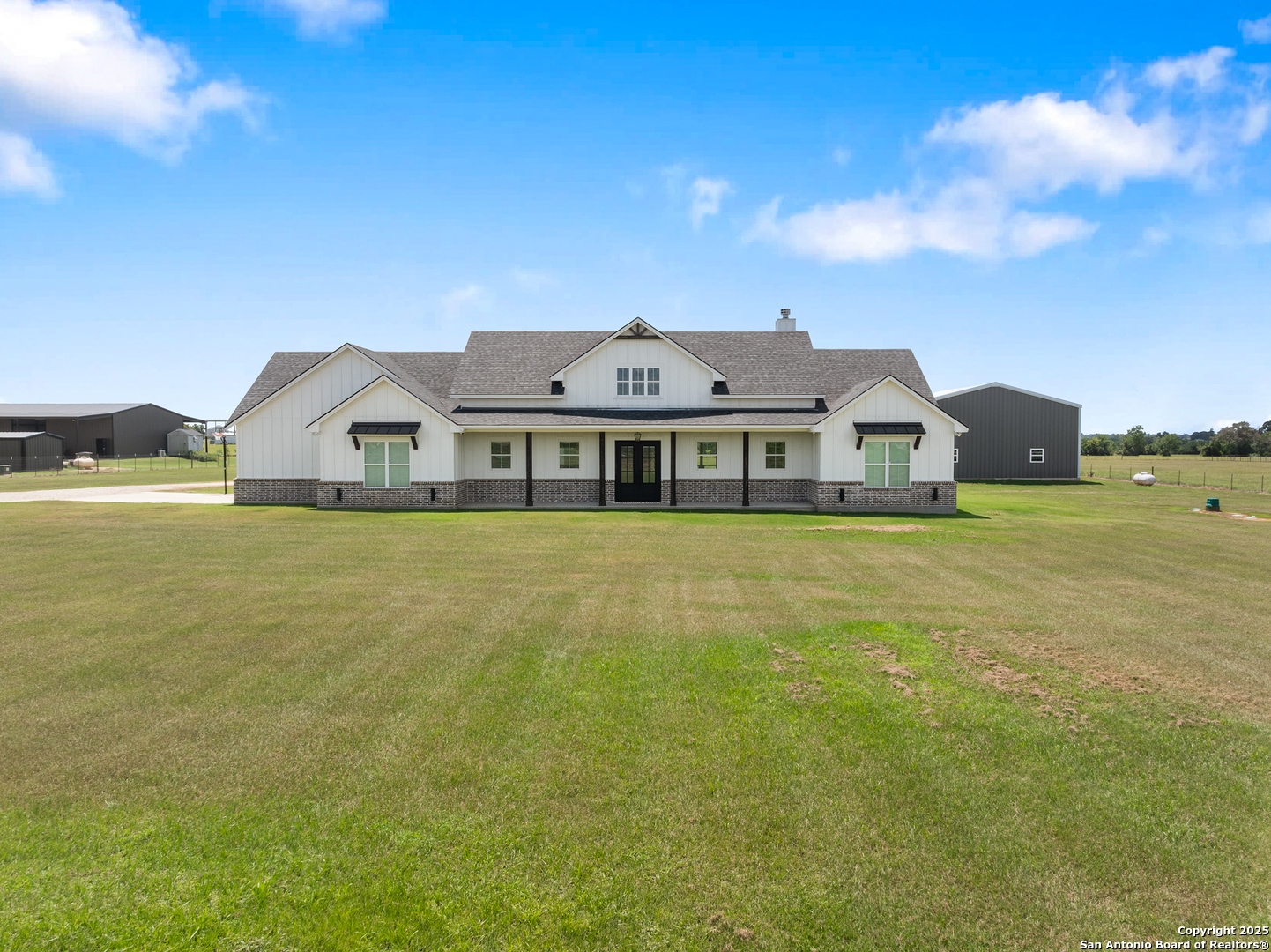 32139 Giboney Road Hempstead, TX 77445 - Photo 2 of 65 a front view of a house with a garden