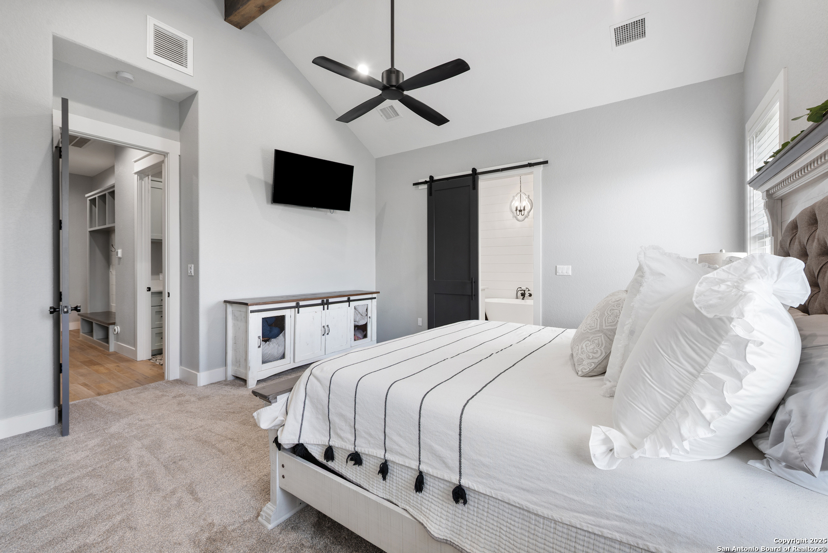32139 Giboney Road Hempstead, TX 77445 - Photo 24 of 65 a bedroom with a bed and a flat screen tv