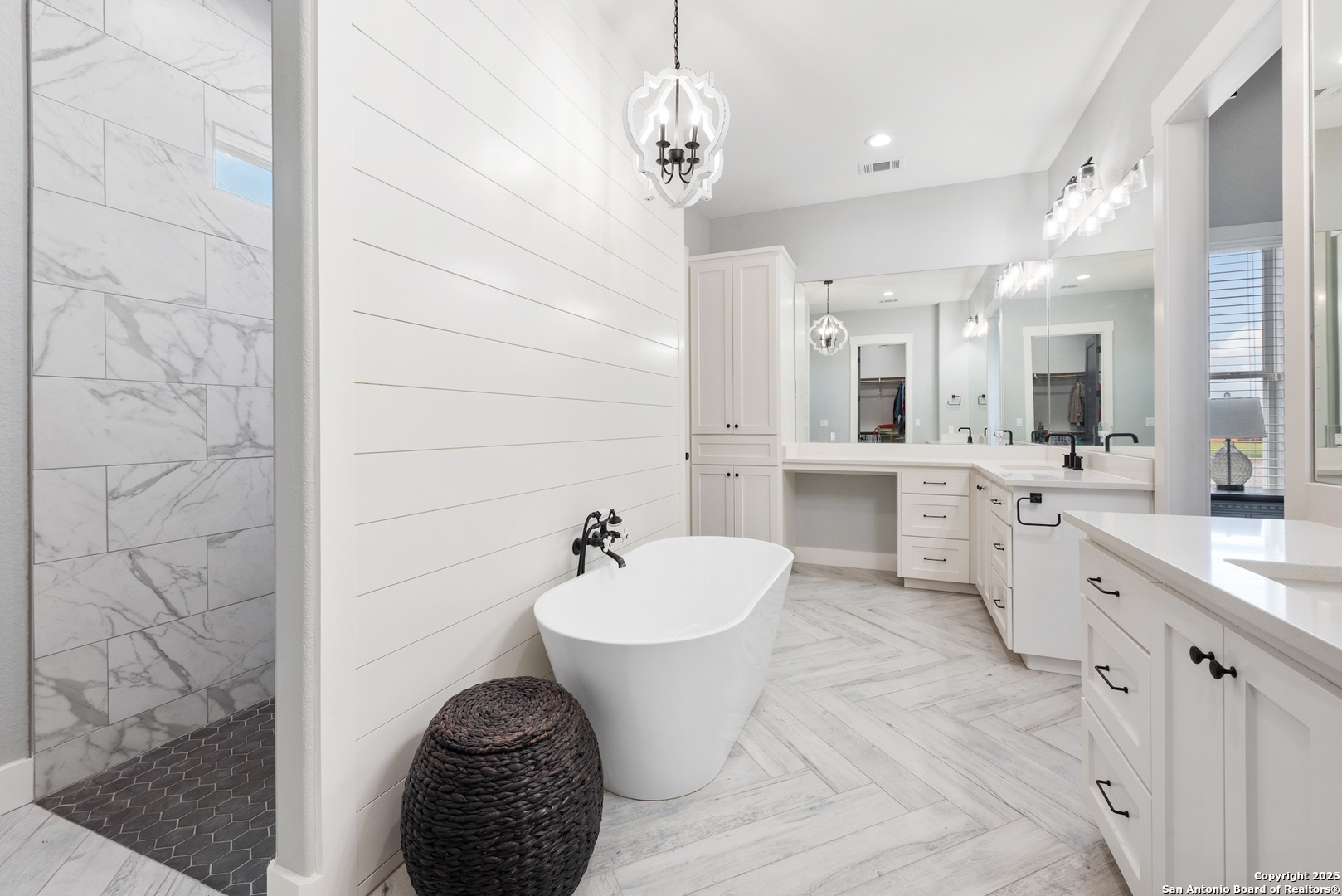 32139 Giboney Road Hempstead, TX 77445 - Photo 27 of 65 a large bathroom with a double vanity sink a mirror and a bathtub