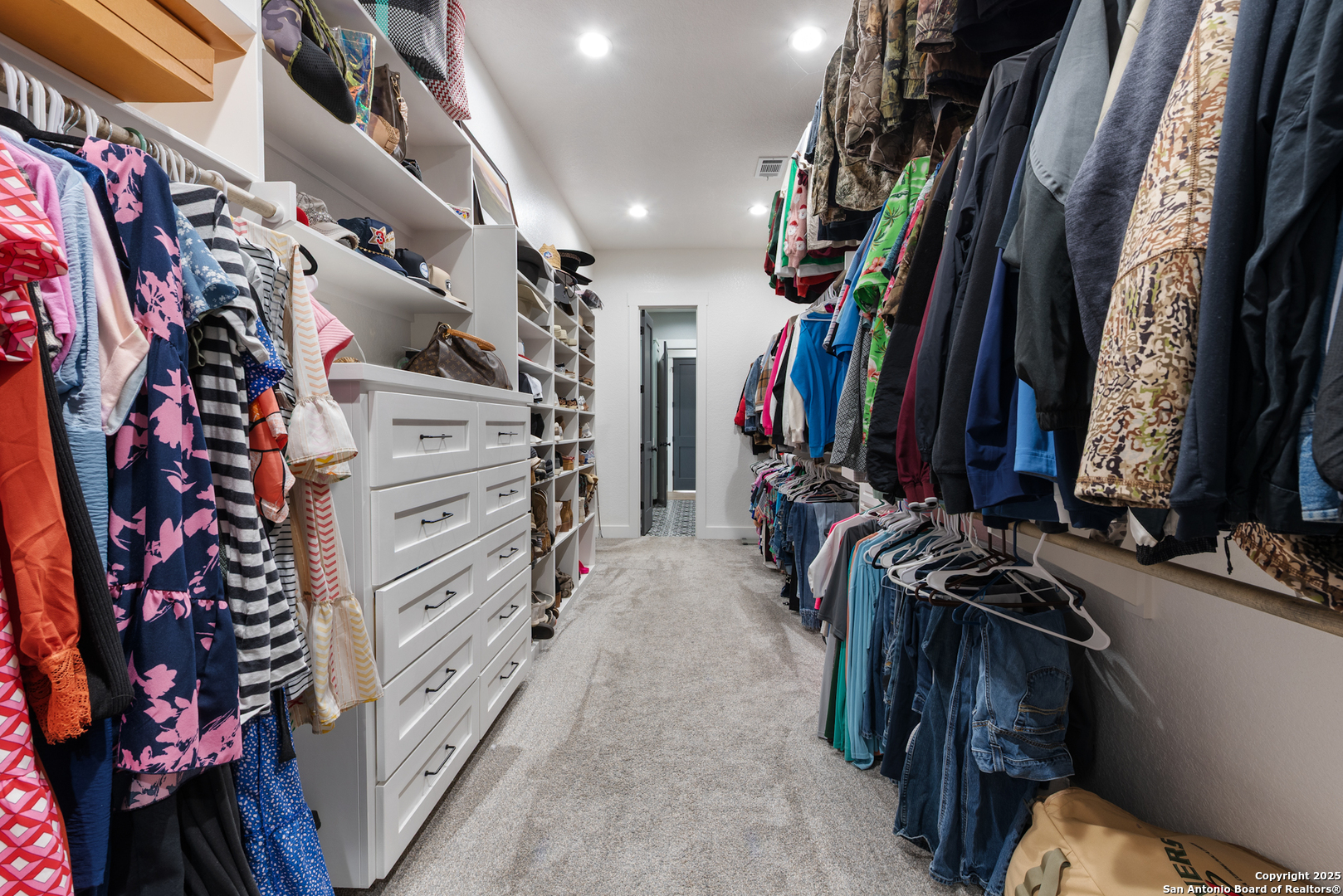 32139 Giboney Road Hempstead, TX 77445 - Photo 31 of 65 a view of walk in closet with clothes