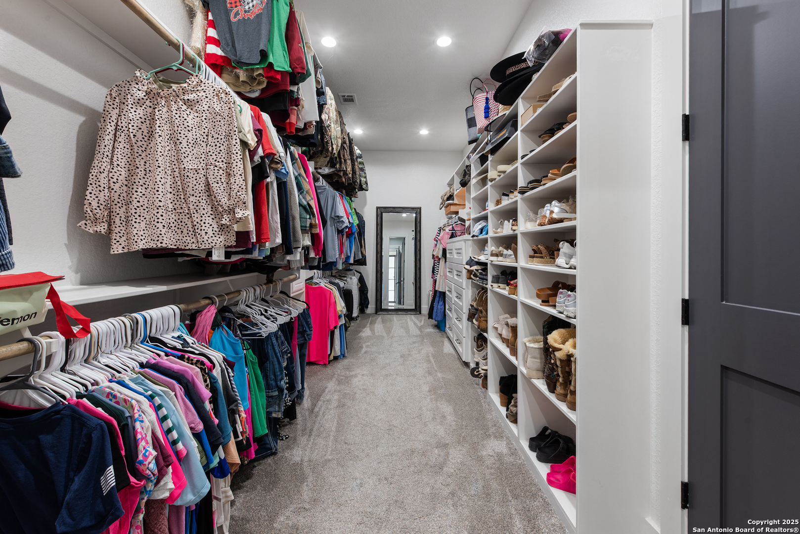 32139 Giboney Road Hempstead, TX 77445 - Photo 32 of 65 a view of walk in closet with clothes