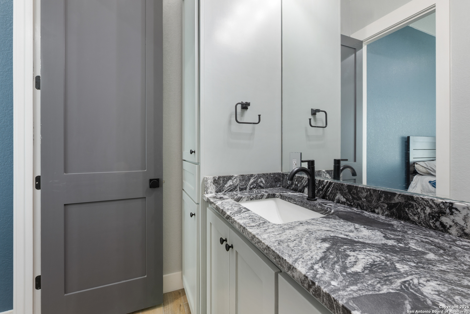 32139 Giboney Road Hempstead, TX 77445 - Photo 40 of 65 a bathroom with a granite countertop sink and a mirror