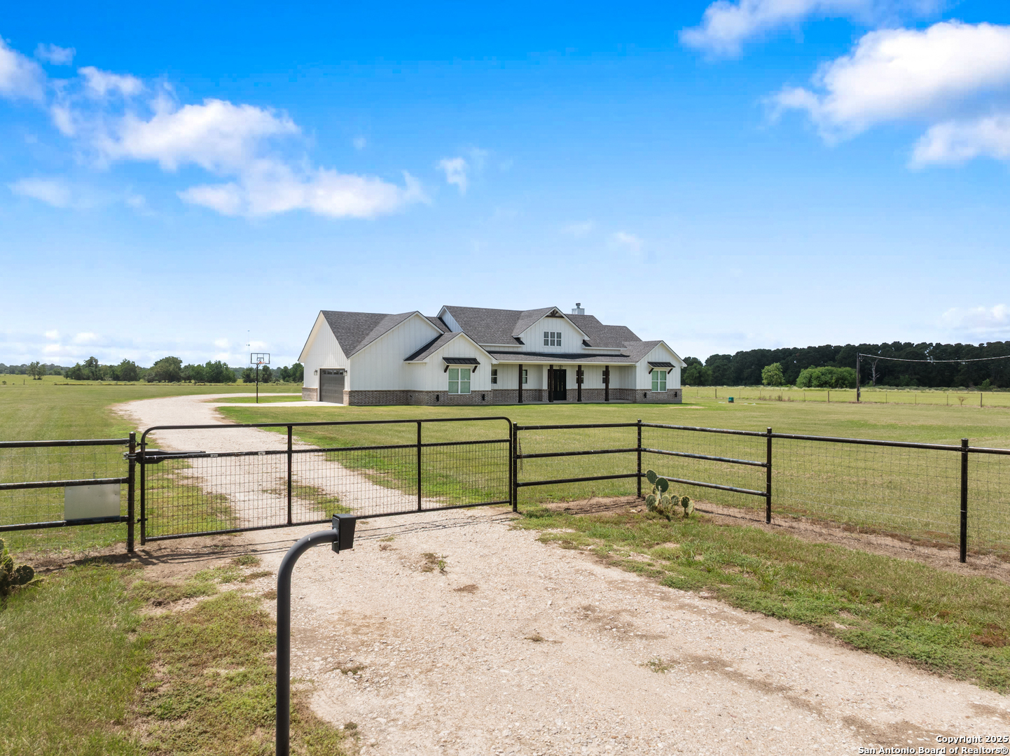 32139 Giboney Road Hempstead, TX 77445 - Photo 4 of 65 a view of a lake with a houses in the back