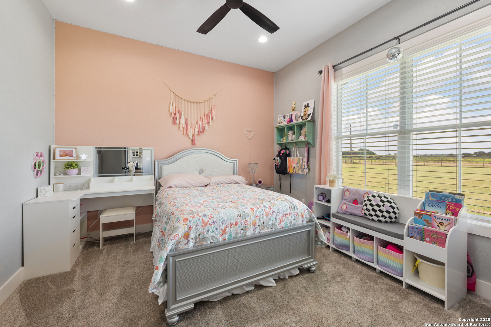 32139 Giboney Road Hempstead, TX 77445 - Photo 46 of 65 a bedroom with a bed and a chandelier
