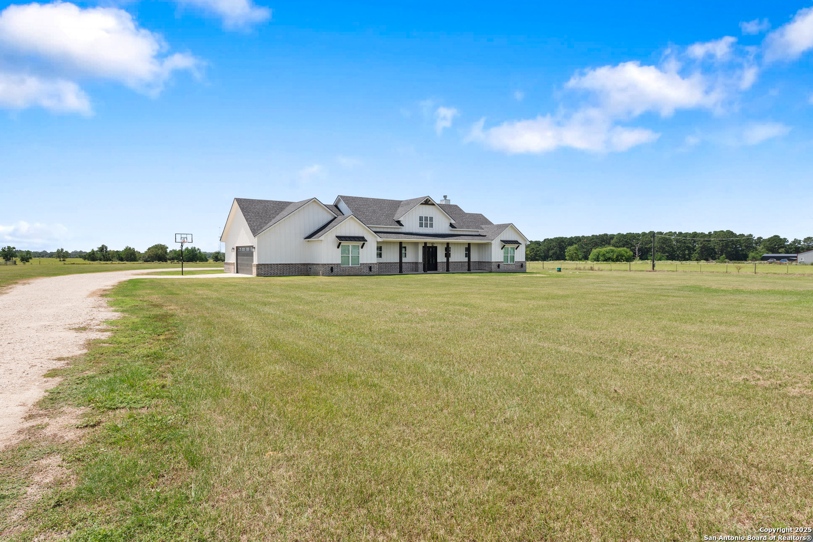 32139 Giboney Road Hempstead, TX 77445 - Photo 5 of 65 a view of a lake with houses in the back