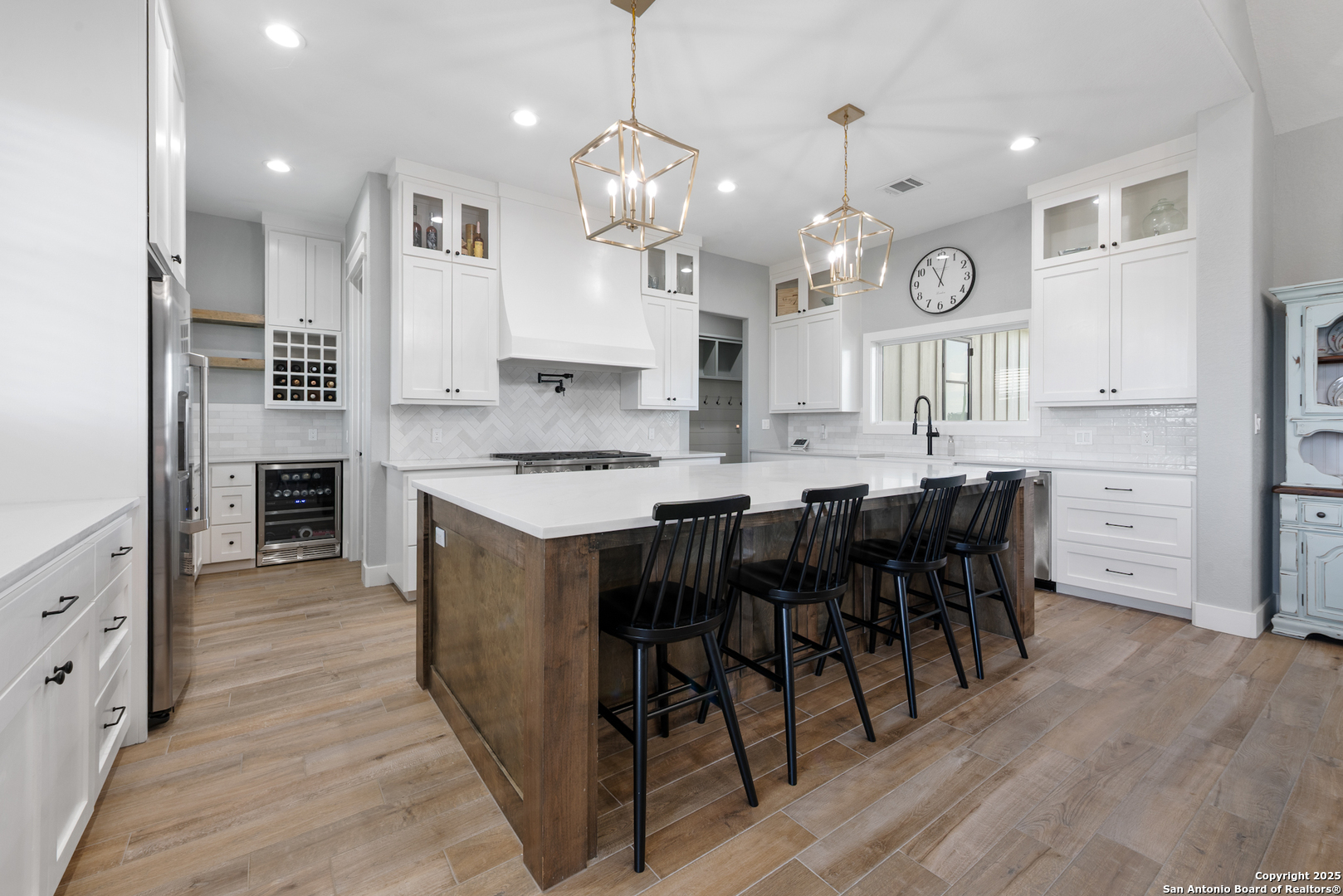 32139 Giboney Road Hempstead, TX 77445 - Photo 6 of 65 a kitchen with stainless steel appliances kitchen island granite countertop a table chairs and a refrigerator