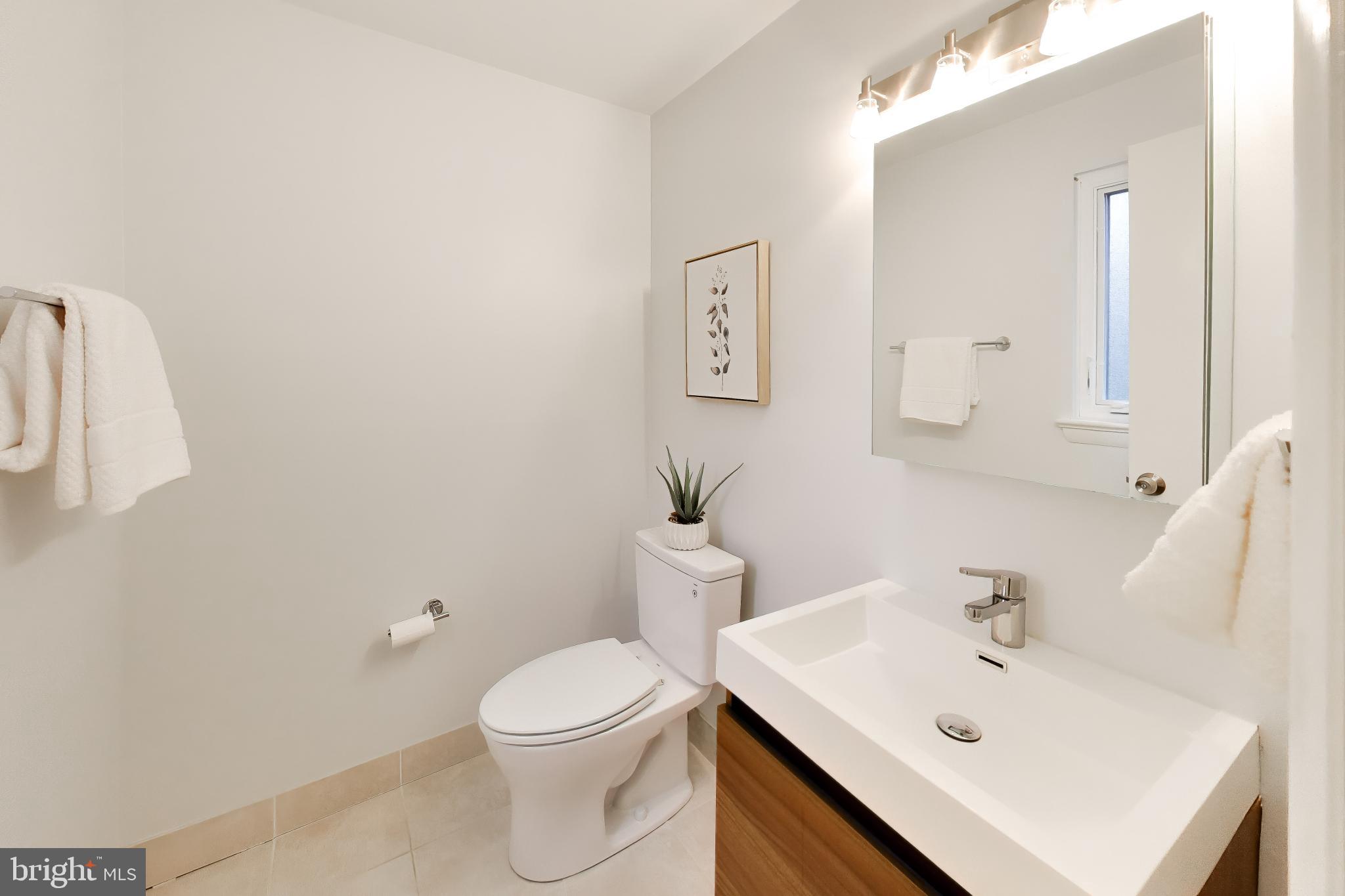 6514 Wilmett Road Bethesda, MD 20817 - Photo 14 of 38 Powder Bath off family room near garage entrance