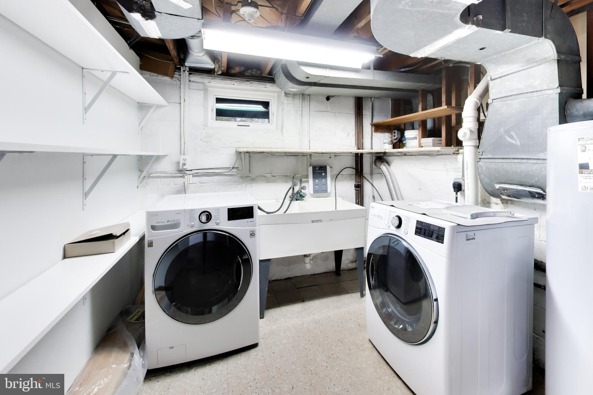 6514 Wilmett Road Bethesda, MD 20817 - Photo 27 of 38 Laundry room with full size front load machines