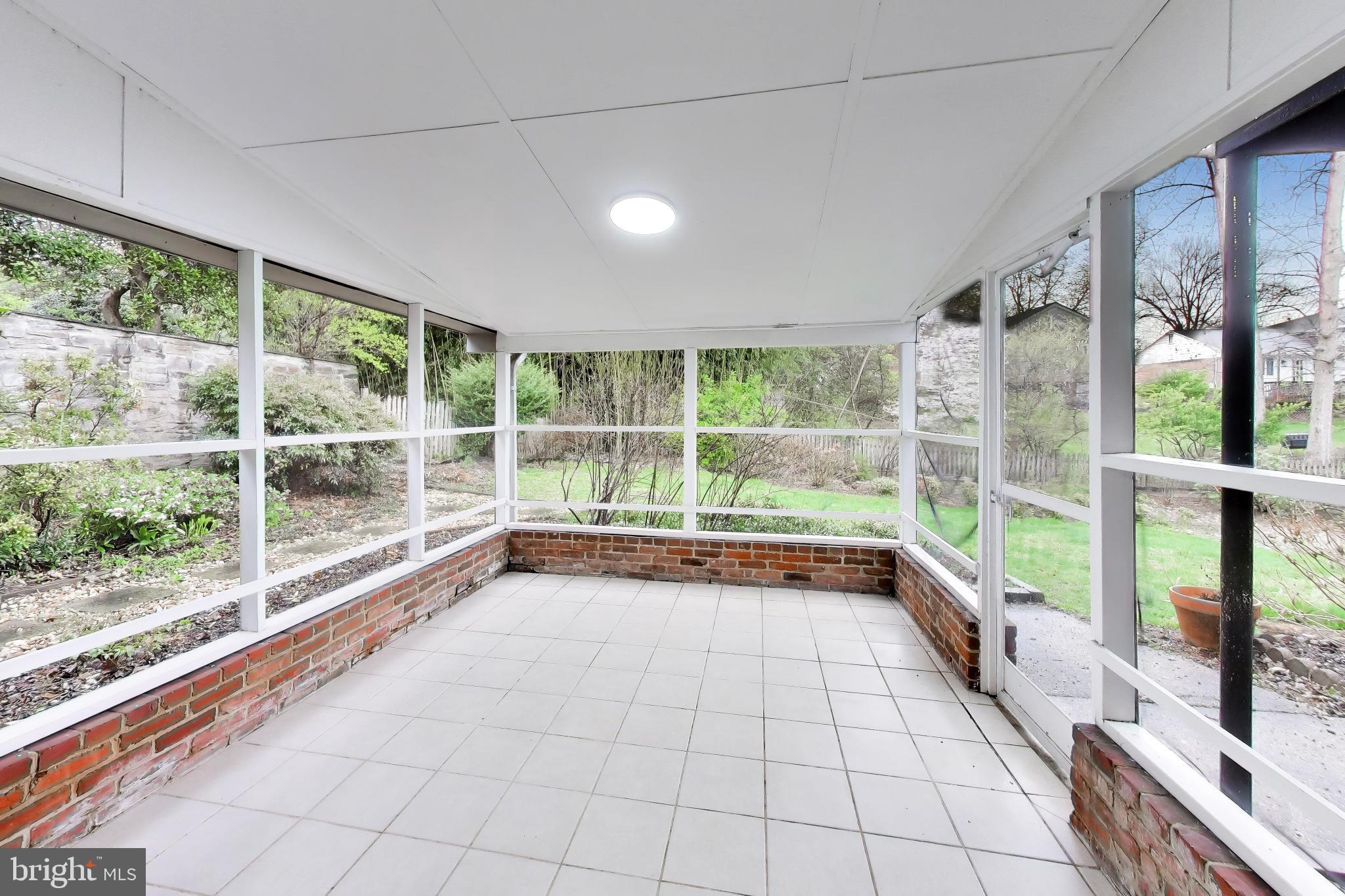 6514 Wilmett Road Bethesda, MD 20817 - Photo 28 of 38 Screened in porch off walk-out family room area