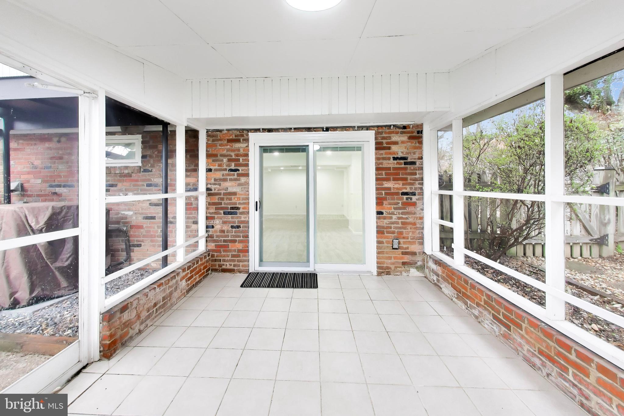 6514 Wilmett Road Bethesda, MD 20817 - Photo 30 of 38 Access to the lower level family room from porch