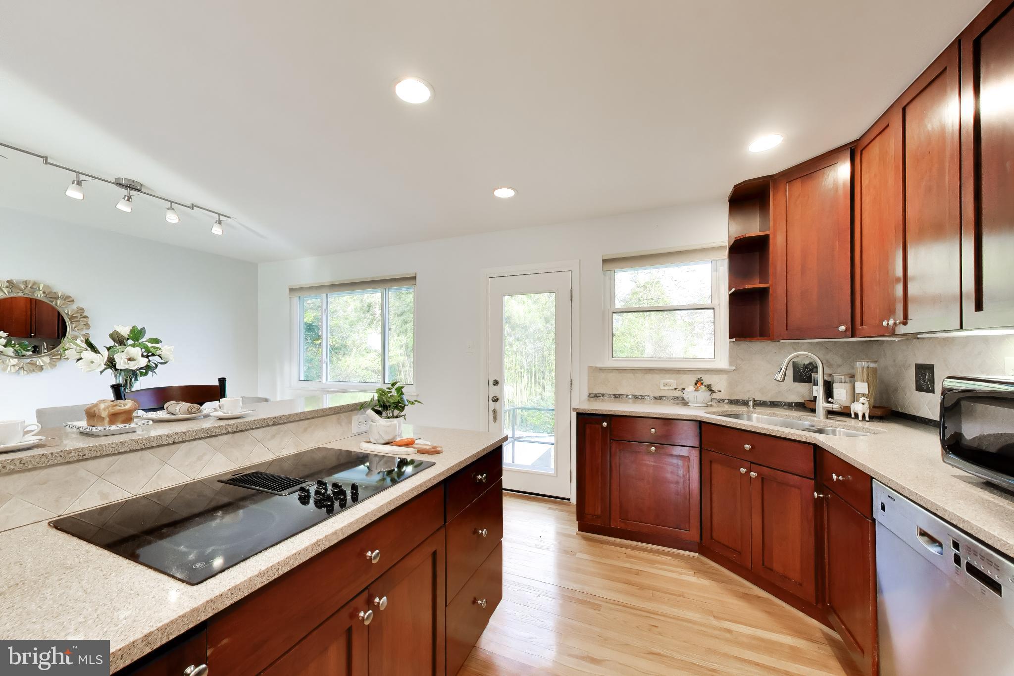 6514 Wilmett Road Bethesda, MD 20817 - Photo 10 of 38 Cooktop and view of kitchen to dining room