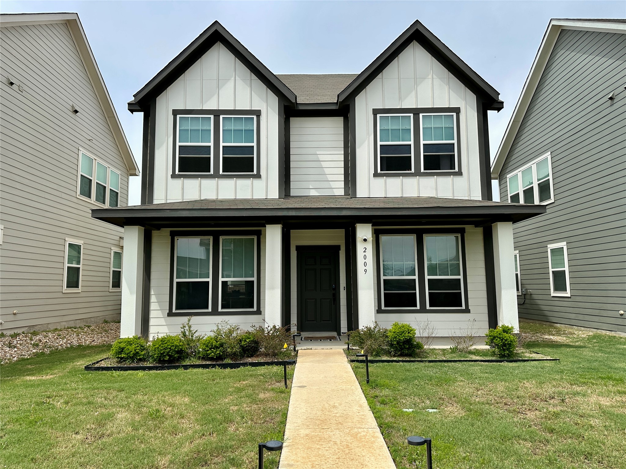 a front view of a house with a yard