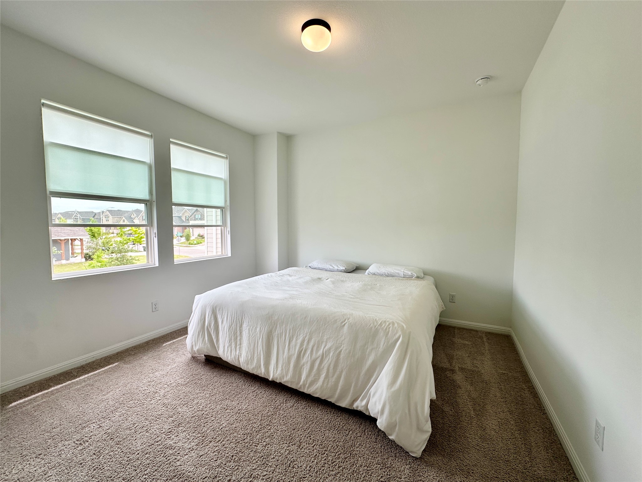 2009 Winston Way Leander, TX 78641 - Photo 13 of 21 a bedroom with a bed and windows